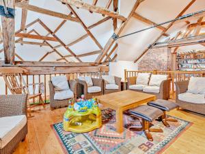 a living room with a table and chairs at 1 Bed in Doncaster oc-93572 in Mattersey