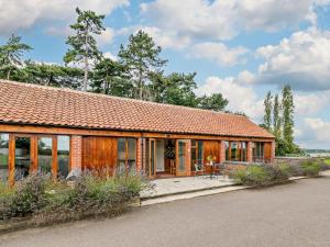 a house with an orange roof and a patio at 1 Bed in Doncaster oc-93571 in Mattersey