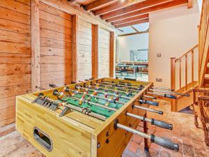 a wooden foosball table in a room with wooden walls at 1 Bed in Doncaster oc-93571 in Mattersey