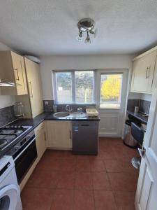 a kitchen with a sink and a stove at Rome avenue in Abingdon