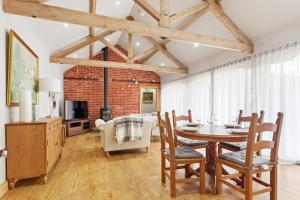 a dining room with a table and chairs at The Saddlery in Norwich