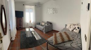 a living room with a couch and a table at Casa Neva in Cannobio +8 photos