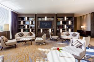 a living room with furniture and a flat screen tv at Crowne Plaza Vientiane by IHG in Vientiane