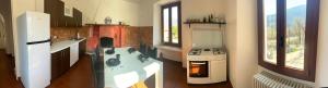 a kitchen with a stove and a stove top oven at Casa Neva in Cannobio