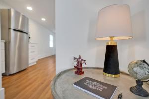 a table with a lamp on top of it at Urban Oasis in Wilmington