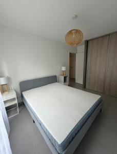 a bedroom with a large bed in a room at RIVIERA COTTAGE in Mandelieu-La Napoule