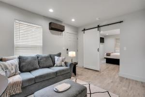 a living room with a couch and a bedroom at The Pearl Stylish Couples Getaway in Wilmington
