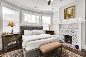 a bedroom with a bed and a fireplace at The Simmons House on 5th Ave in Wilmington