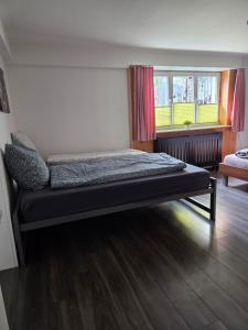 a bedroom with a bed in a room at Ferienwohnung FeWe Wandern und Skifahren in Triesen