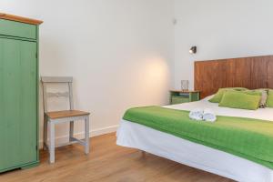 เตียงในห้องที่ Casas do Vale -T2