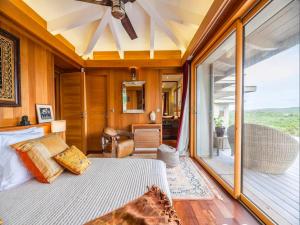 a bedroom with a bed and a large window at Villa Carla in Bonifacio +24 photos
