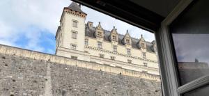 a view of a large building from a window at centre Pau proche Chateau et gare 33 m2 in Pau