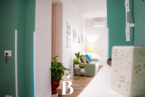 a living room with blue and white walls and a couch at Belvedere Benedetto in Castelnuovo Parano