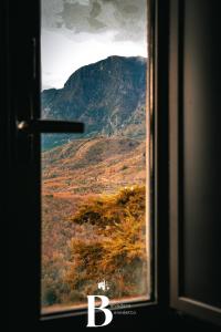 a view of a mountain from a train window at Belvedere Benedetto in Castelnuovo Parano +21 photos