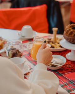 a person sitting at a table with a plate of food at Tenuta Vigna del Noce in Corato