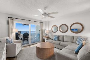 a living room with a couch and a table at Boardwalk Unit E4 in Pensacola Beach