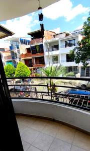a balcony with a view of a building at Tu Estancia en Cali - Valle del Lili in Cali