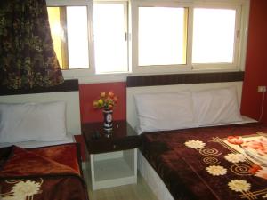 A bed or beds in a room at Isis Hostel 2