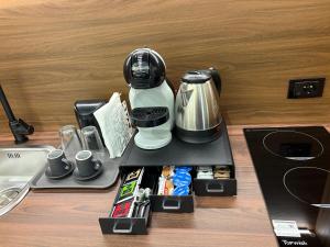 a counter with a coffee maker and food on it at B&B Da Vinci in Cassano delle Murge