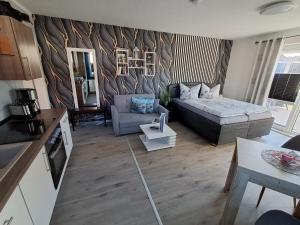 a living room with a couch and a table at Ferienwohnung Luna in Stralsund