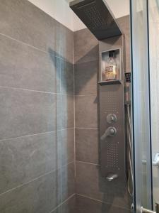 a bathroom with a shower with a glass door at Villa Club T2 complètement rénové à Mar Vivo, plages à pieds, piscine in La Seyne-sur-Mer