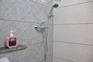 a shower with a shower head in a bathroom at Gypsy Soul Gateaway - Casa Boho in Zirakpur