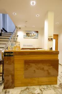 a bar in a building with a staircase at Hotel Golden Palace in Agra
