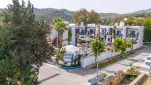 an aerial view of a hotel with palm trees at Orion hotel in Bodrum City