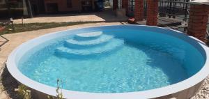 a large pool of water with a spiral in it at Cazanele Dunarii "La Cumatru" in Dubova