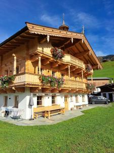 a building with a bench in front of it at Ferienwohnung Altrach in Aurach bei Kitzbuhel