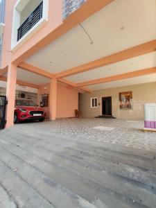 a garage with a car parked in it at Hotel Rhythms Residency in Chennai