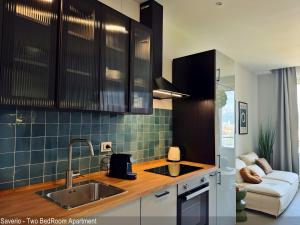 a kitchen with a sink and a counter top at Saverio & Daria Aprtements by Mamo Florence in Florence