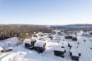 an aerial view of a village covered in snow at Ljungvind Kåvan - Funäsdalen in Funäsdalen