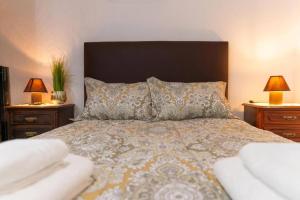 a bedroom with a large bed with two night stands at Casa Fernandes by Mth in Ribeira Brava