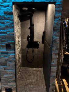 a bathroom with a shower with a sink at Taelia spa in Rosult +7 photos
