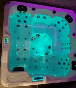 a plastic bathtub with blue liquid in it at Taelia spa in Rosult