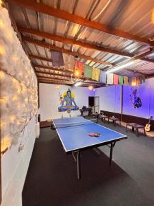 a ping pong room with a ping pong table in it at OLT Hostel Rishikesh in Rishīkesh