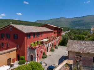 an aerial view of a town with red buildings at Red Palazzo Fossanova in Priverno