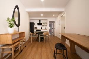 a kitchen and dining room with a table and a mirror at Sarridal, Lar Atlántico in Cedeira +36 photos