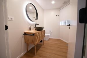 a bathroom with a sink and a mirror at Sarridal, Lar Atlántico in Cedeira