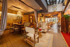 a living room filled with furniture and a table at Abalú Collection Hotel Life Gran Via in Madrid