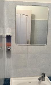 a mirror above a sink in a bathroom at Sunrise View Farm-stay -Narkanda in Shimla +43 photos