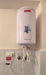 a water heater on the wall of a room at Sunrise View Farm-stay -Narkanda in Shimla