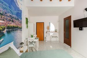 a bedroom with a view of a lake and mountains at Lecco's heart! Centro Lecco - A due passi dal lago - Moderno e luminoso in Lecco