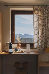 a window with a view of a mountain view at Les Terrasses de la Borie in Mandagout