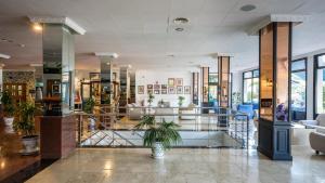 a lobby with a potted plant in a building at BLUESEA Costa Jardin & Spa in Puerto de la Cruz
