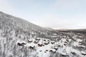 an aerial view of a village in the snow at Blåstöten Osthang - Ramundberget in Bruksvallarna