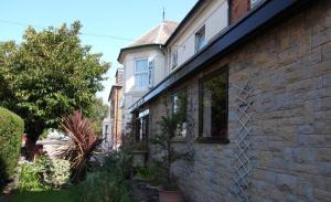 a brick house with a window on the side of it at Hylands Hotel Double Room with Shared Bathroom & Free Parking in Nottingham