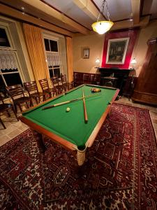 a pool table sitting on top of a rug at The Old Labor House 1525 in Wolsum