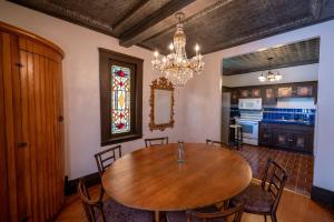 a dining room with a wooden table and chairs at Historic Loft Two 01 in Carson City +27 photos